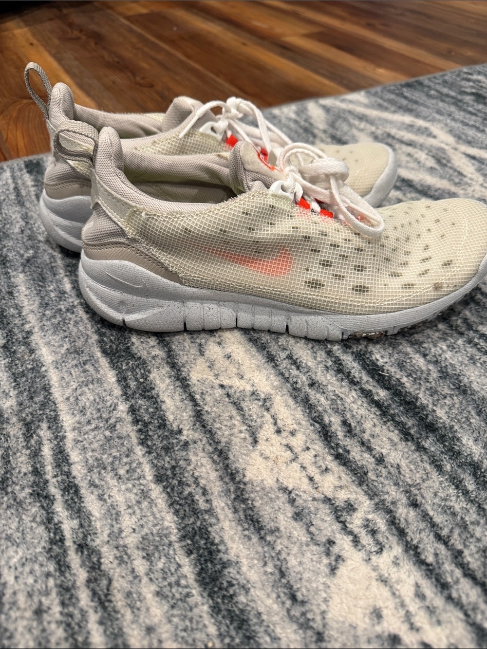 Nike White Mesh Athletic Sneakers with Orange Swoosh